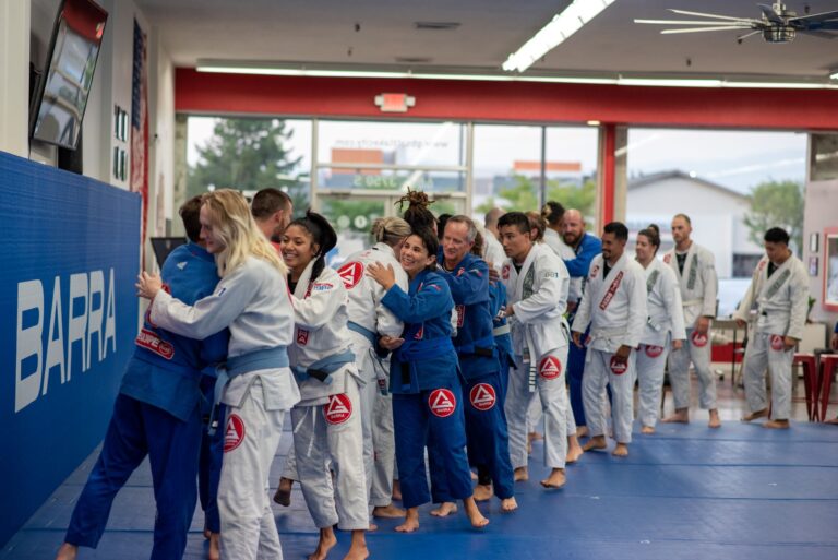 Part of Gracie Barra Riverton's students in line greeting the professor and coaches