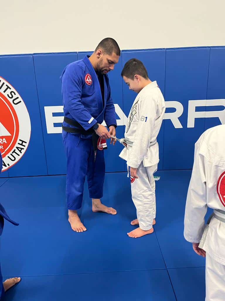 professor seidler rodrigo graduating a teen bjj student at gracie barra west jordan